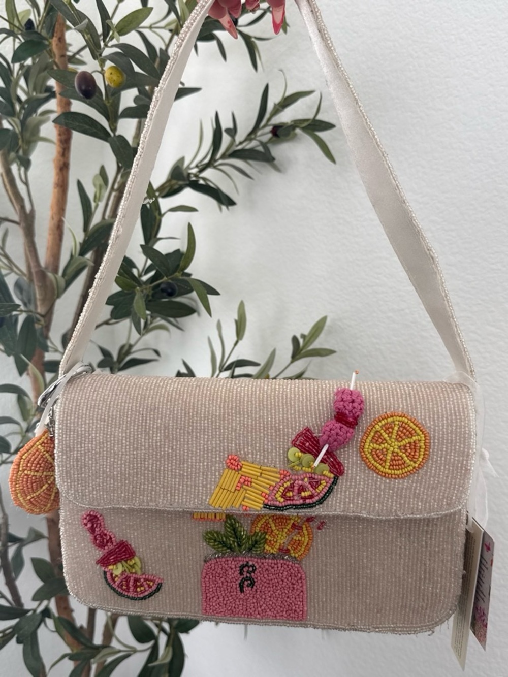 Beaded purse with embroidered fruit and drink scene handcraft in india